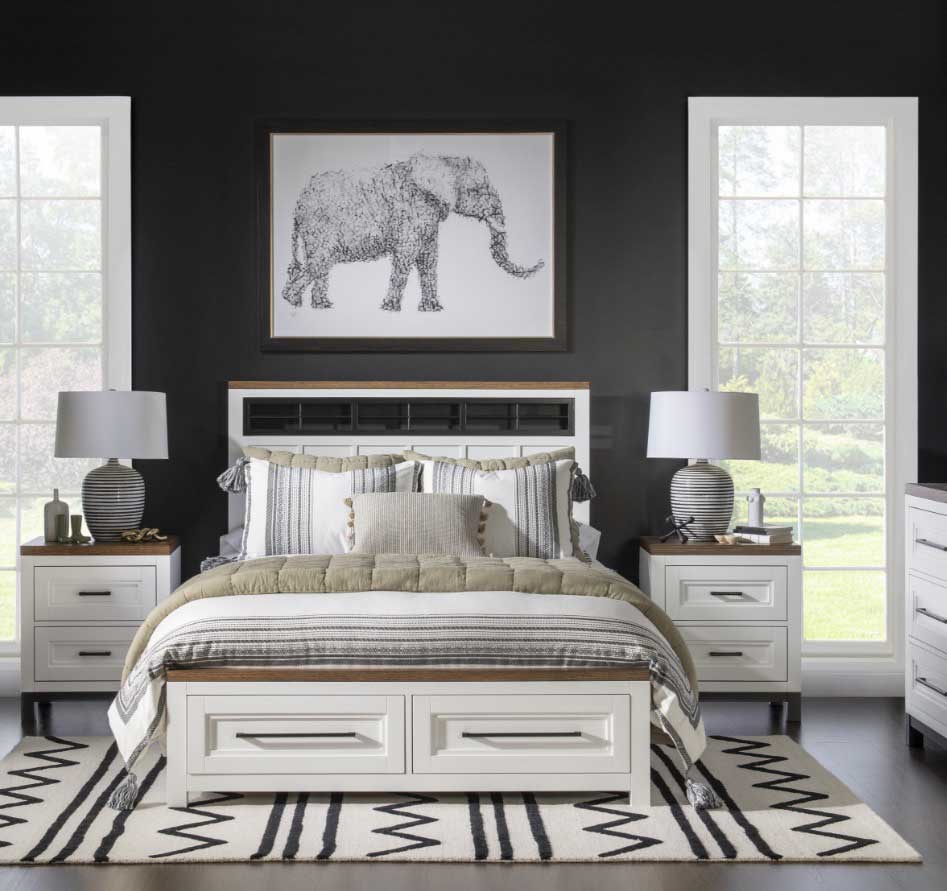 tradiional bedroom with dark paint and an elaphant picture